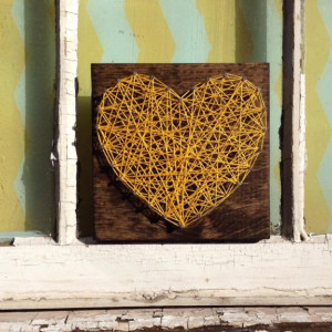 Nail and String Art Heart in Yellow on Stained Wood