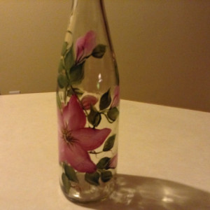 Handpainted oil dispenser with pretty pink wild roses and green leaves. Includes spout.