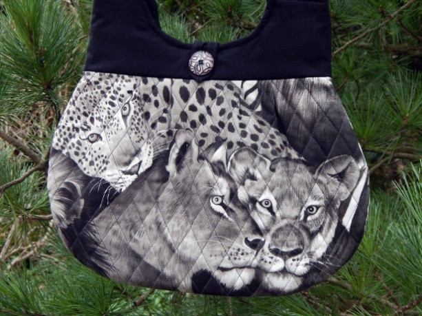 Lions and cheetahs quilted hobo style handbag