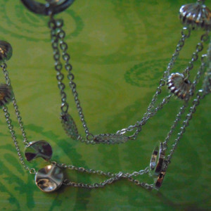 Various Silver Beads Linked With Chains