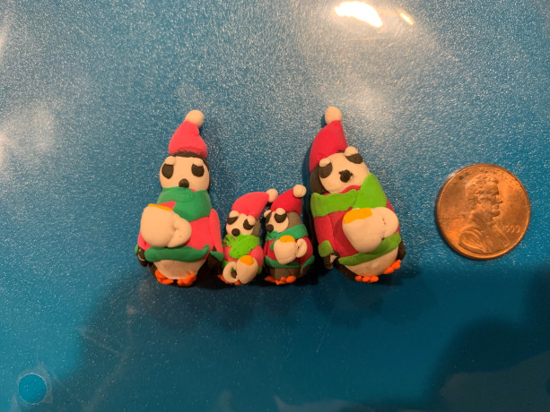 Penguin Family with Christmas Sweaters