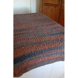 Hand crocheted boho cobble afghan in taupe with subtle wheat blended rainbow colors.