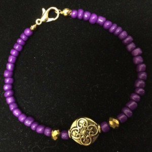 purple and gold bracelet