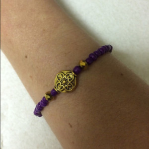 purple and gold bracelet