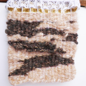 A Hand-Woven Wall Hanging on Tree Bark