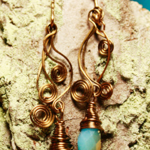Copper spiral earrings with blue teardrop stone