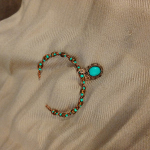 Woven wire pendant with turquoise dyed accent