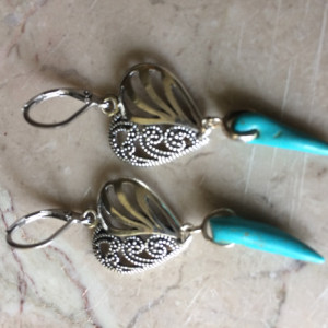 Earrings made with Turquoise spike beads,decorative silver tone heart and stainless steel lever back earrings. #E00342