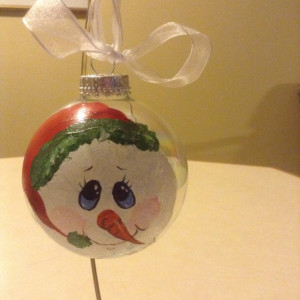 Handpainted snowmen ornaments with beautiful detailed faces and coordinating ribbon hangers.