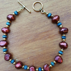Rich burgundy, gold and navy blue beads bracelet, golden color clasp and wire