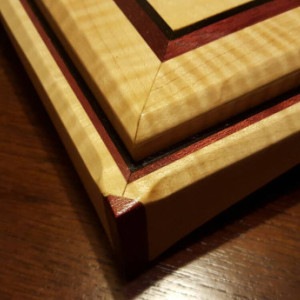 Chessboard made of purple heart and quilted maple with ebony inlays