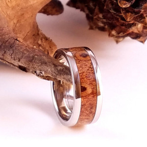 size 4 7/8 Pinecone ring around a Stainless steel core  with Stainless edges, 9mm wide band