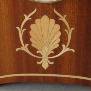 Mantle clock of Ribbon sapele with inlay.