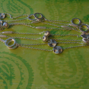 Various Silver Beads Linked With Chains