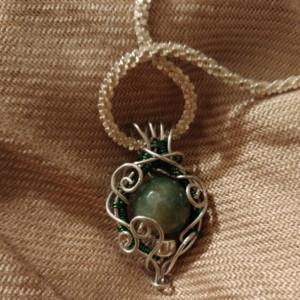 Silver and green glass filigree pendant