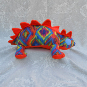 Rainbow Pattered Small Stegosaurs Dinosaur With Neon Orange Accents