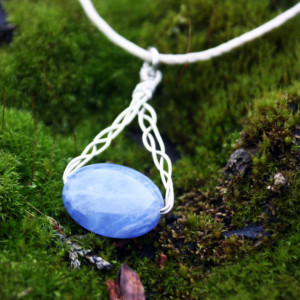 Sodalite pendant with nontarnishable wire on a white hemp cord