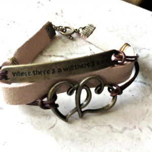 Beige/ natural leather bracelet with bronze tone plate connector said "Where there's a will there's a way" and double heart charm B00243