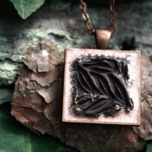 Dark purple leaves on copper pendant with necklace