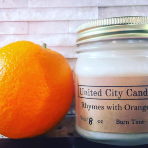 Rhymes with Orange No. 61 -- Florida citrus sunshine.  This candle bursts with Vitamin C. 100% soy candle. United City Candle Co Made in USA