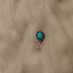 Woven wire pendant with turquoise dyed accent