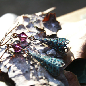 Unique patina earrings accented with purple crystal 