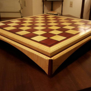 Chessboard made of purple heart and quilted maple with ebony inlays