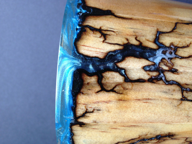 Wood vase with fractal Burns filled with blue pigment 