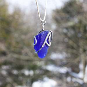Navy (deep) blue sea glass with a wire heart on a white hemp cord