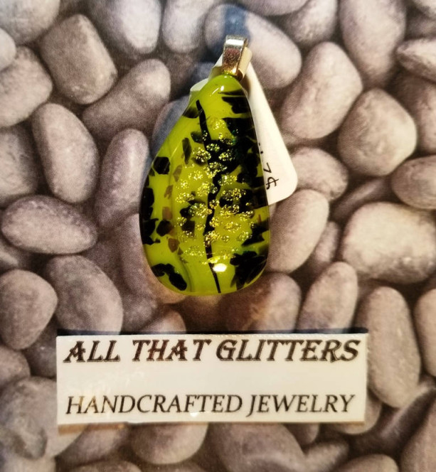 Dichroic Pendant on green background with black swirls and gold accents with sterling silver finding. Great gift idea for any occasion.