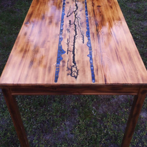 Custom table and two chairs with fractal Burns,blue resin river,and wood Burns threw out 