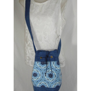 Crossbody TIE DYED BUCKET Bag with large mouth opening and blue denim accents and straps