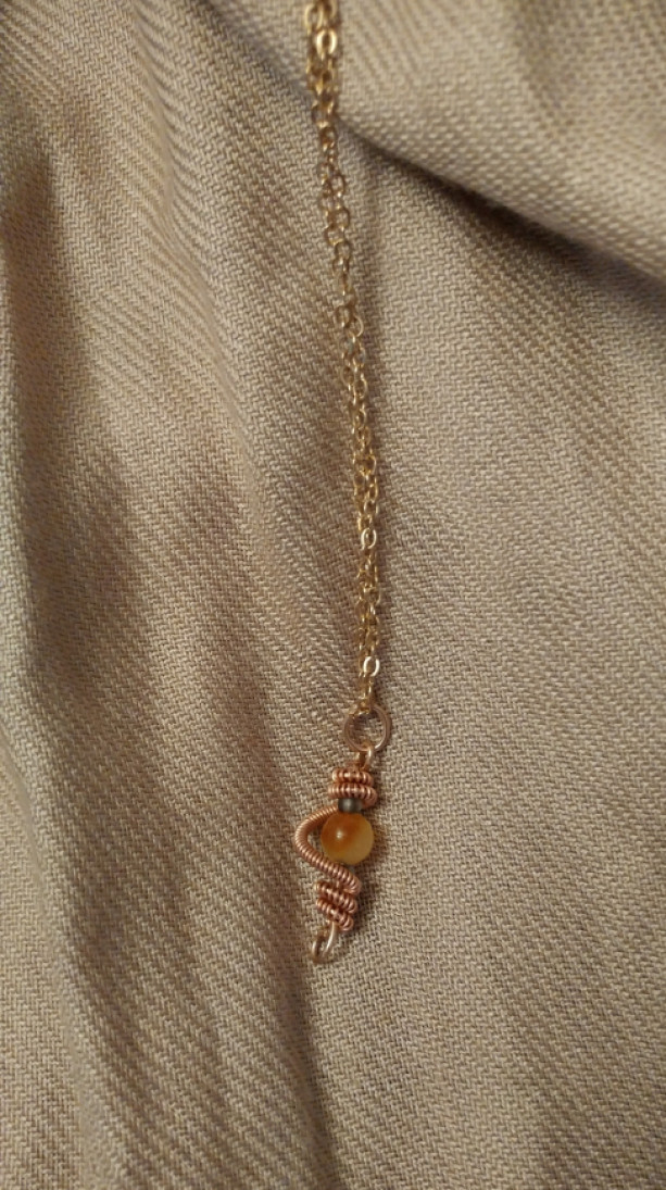Drop pendant with stellar swirl in copper