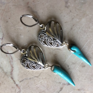 Earrings made with Turquoise spike beads,decorative silver tone heart and stainless steel lever back earrings. #E00342