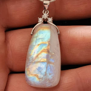 Rainbow moonstone of great quality 27ct pendant with a .925 sterling silver bail accented with 3 CZ stones and optional necklace