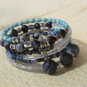 Six layered wrap bracelet with blue and silver beads.