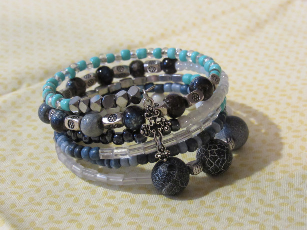 Six layered wrap bracelet with blue and silver beads.