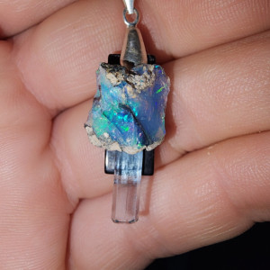 Blue dream pendant black onyx back, Rough African opal with raw aquamarine through the center.