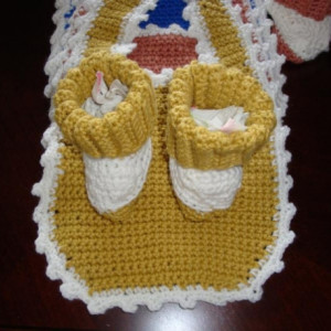 A complete seven day set of booties and bibs. One for each day of the week.
