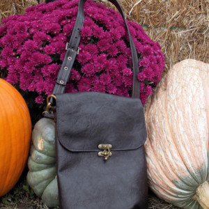 Leather bag or leather purse, black with adjustable shoulder strap and antique brass hardware