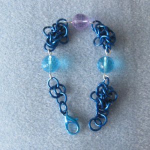 Chainmaille bracelet Blue and Purple glass beads on blue chainmaille links