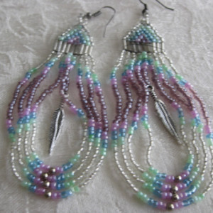 Native American style dangle earrings. 4.5"long in a draped loop and feather