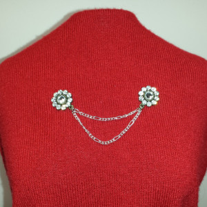 Rhinestone and silver chain sweater pin