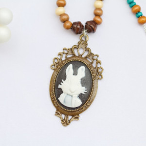 Alice in Wonderland white rabbit pendant with various wood beads and black network stones and black glass seed beads/Under 20 dollars