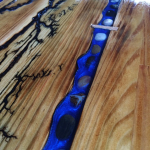 Custom table and two chairs with fractal Burns,blue resin river,and wood Burns threw out 