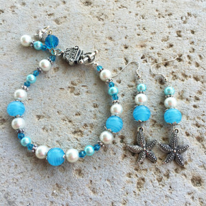 Silver-toned, turquoise and white glass pearl starfish charm bracelet & earrings