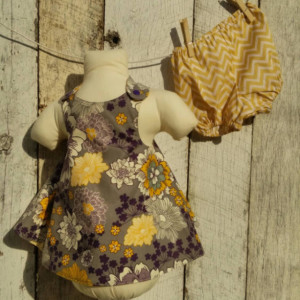 Reversible dress and bloomers set. Grey with yellow and purple flowers.