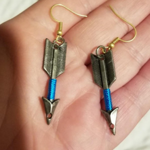Silver arrow hook earrings with blue around arrow