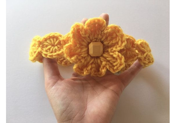 Crochet head band with flower in yellow