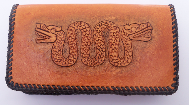 Golden Tan leather checkbook cover, tooled Aztec serpent on cover.